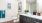 bathroom with a vanity and mirror and a toilet