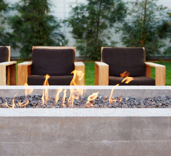 Contemporary fireplace with chairs in a row at restaurant